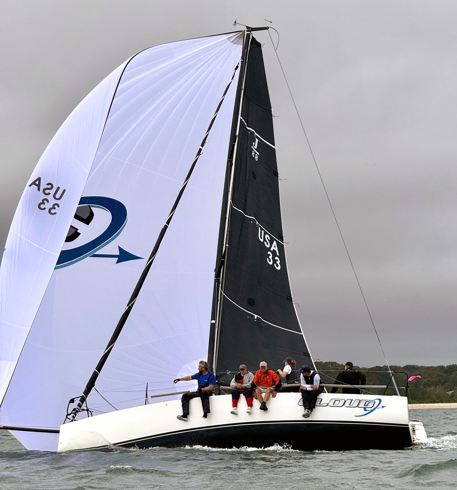 John Sommi, J-88 Cloud 9 skipper, managed a streamlined crew to a respectable third place in spinnaker Division 1.   MICHAEL MELLA