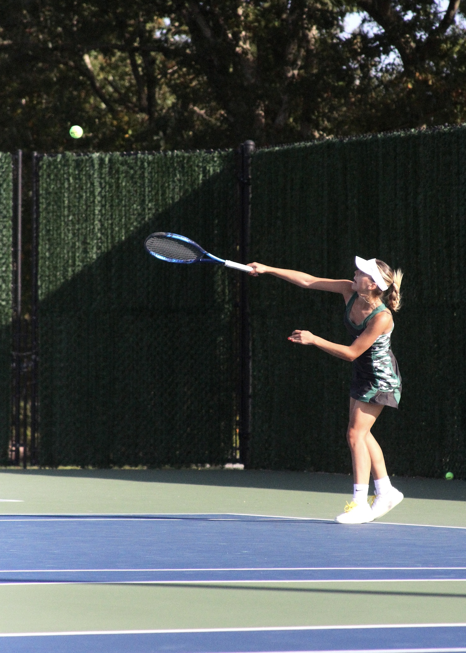 Senior Ana-maria Bichinashvilli serves. DESIRÉE KEEGAN