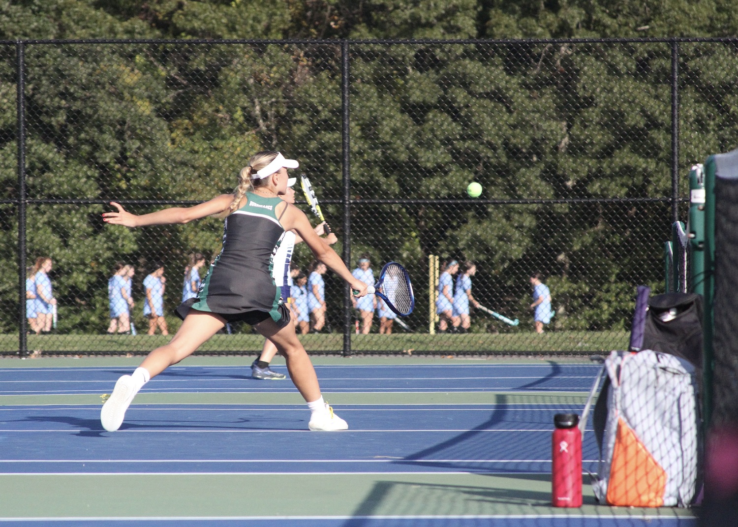 Senior Ana-maria Bichinashvilli grabs the ball with her backhand. DESIRÉE KEEGAN