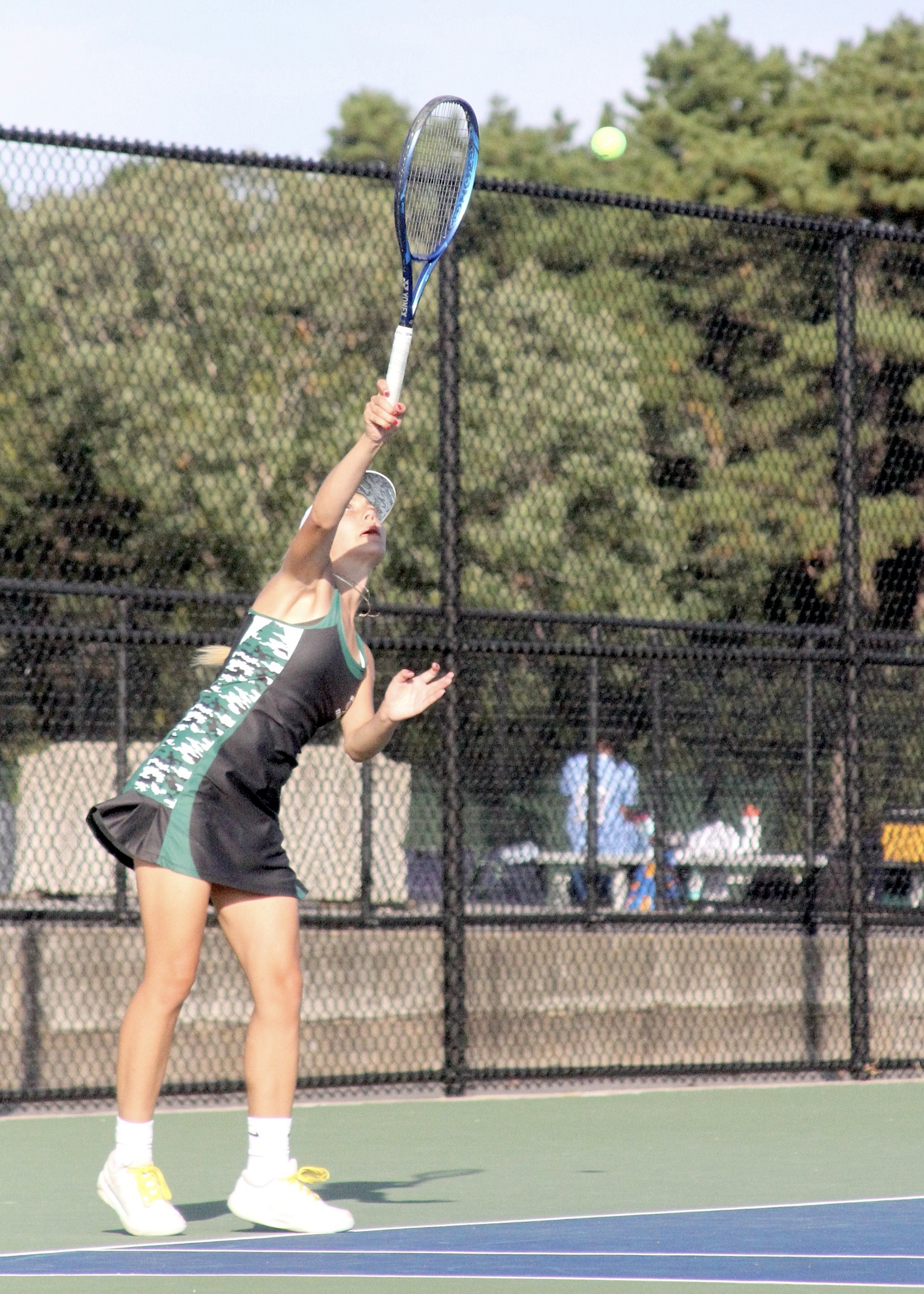 Senior Ana-maria Bichinashvilli serves. DESIRÉE KEEGAN