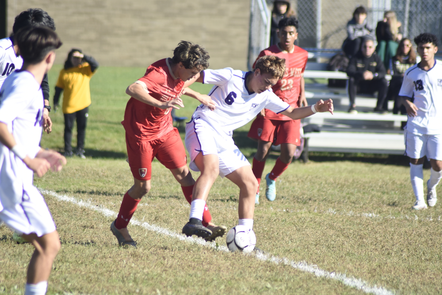 Baymen Edie Cabrera fends off a Hills West player.   DREW BUDD