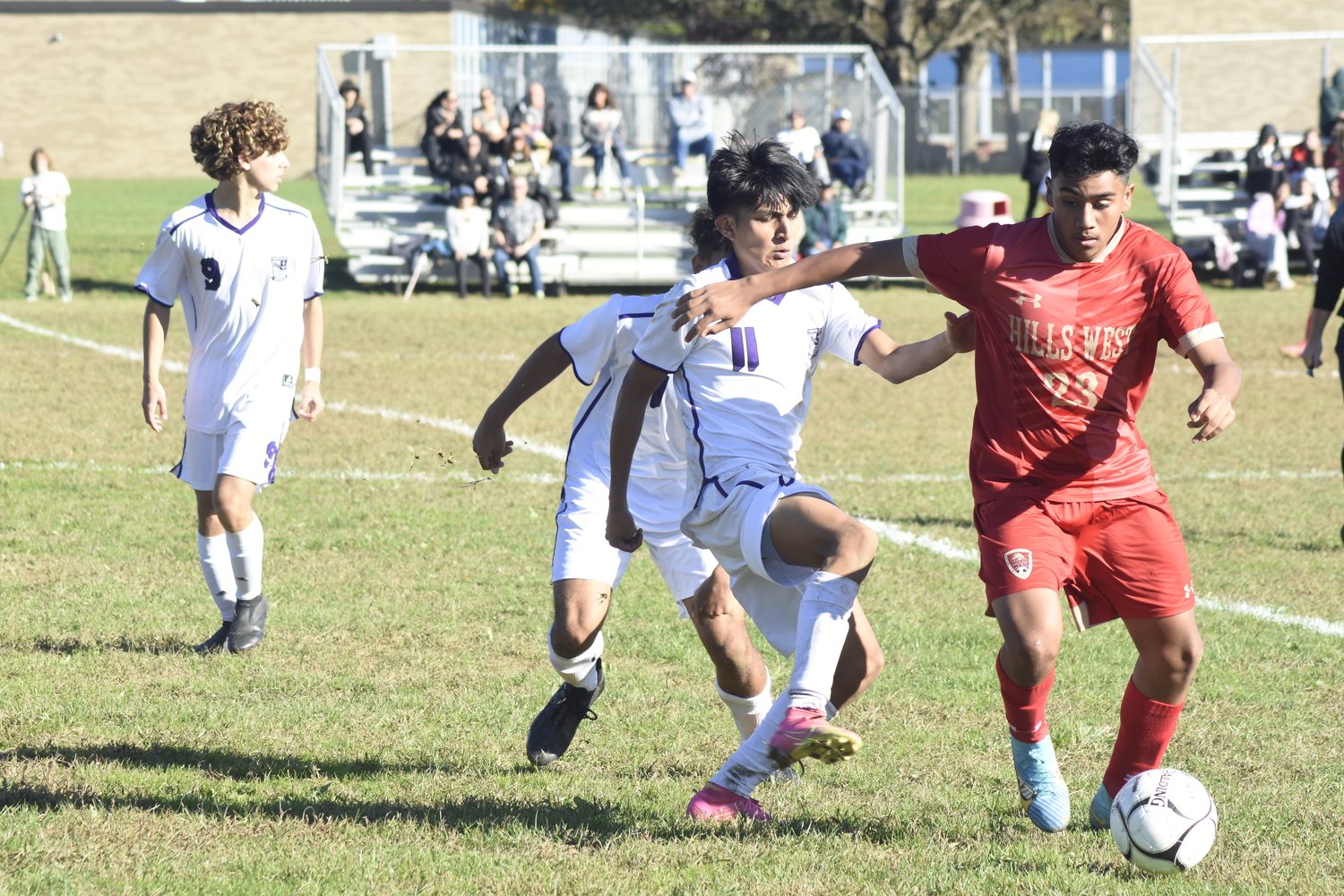 Hampton Bays senior Jordy Villa pressures a Hills West player.   DREW BUDD