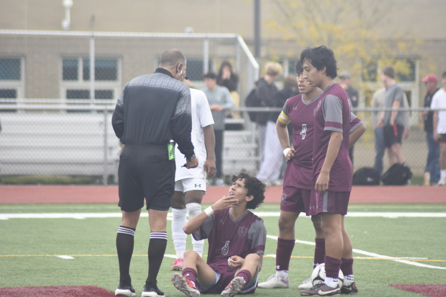 Ariel Garcia and his teammates ask for a foul after he was hit in the face.   DREW BUDD