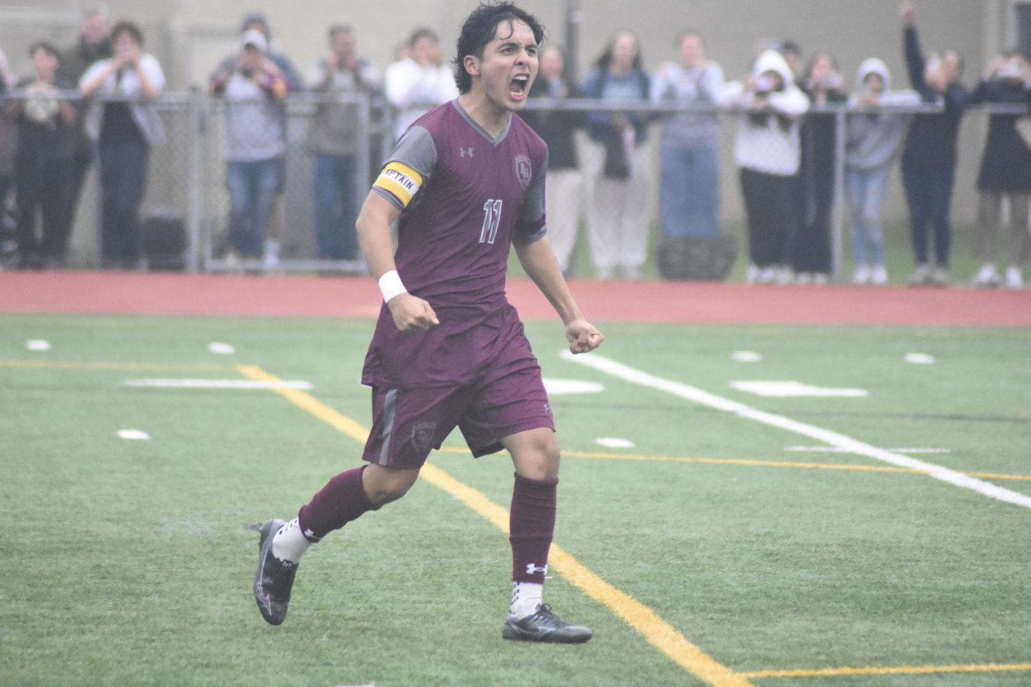 Senior co-captain Gary Gutama reacts after scoring on the first penalty kick for the Bonackers.  DREW BUDD