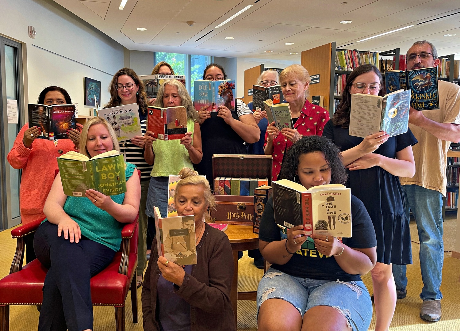 Staff members of the John Jermain Memorial Library read their favorite banned books. Front row, from left, Kelly Harris, Rita Skerys and Nancy Myers. Second row, Aracely Garcia, Catherine Tremblay, Donna Fisher, Andrea Hill, Sue Mullen, Rachel Lucas and Richard Browning. Third row, Ginta Genender and Susan Blumenkrantz. COURTESY JOHN JERMAIN MEMORIAL LIBRARY