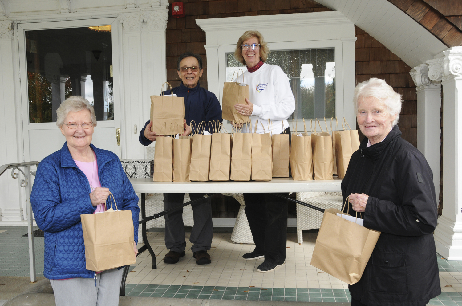 Sister Maryan Hoyne, Father Larry Lewis, M.M.,Cormaria Director Joan McGivern and Sister Martina Crowley during Sunday's drive-through 