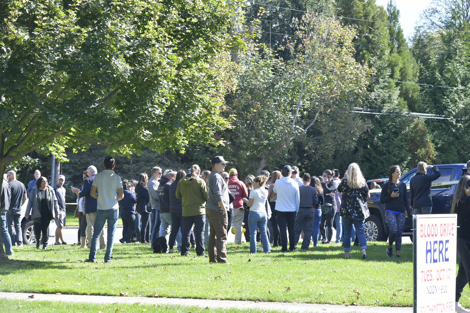 Parents wait to collect their children after a bomb threat was sent to a Southampton School administrator.  DANA SHAW