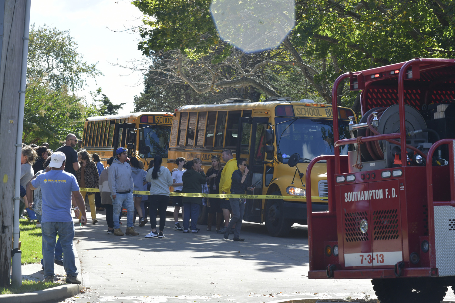 A line of buses wait to transport children after a bomb threat was sent to a  Southampton School administrator.  DANA SHAW