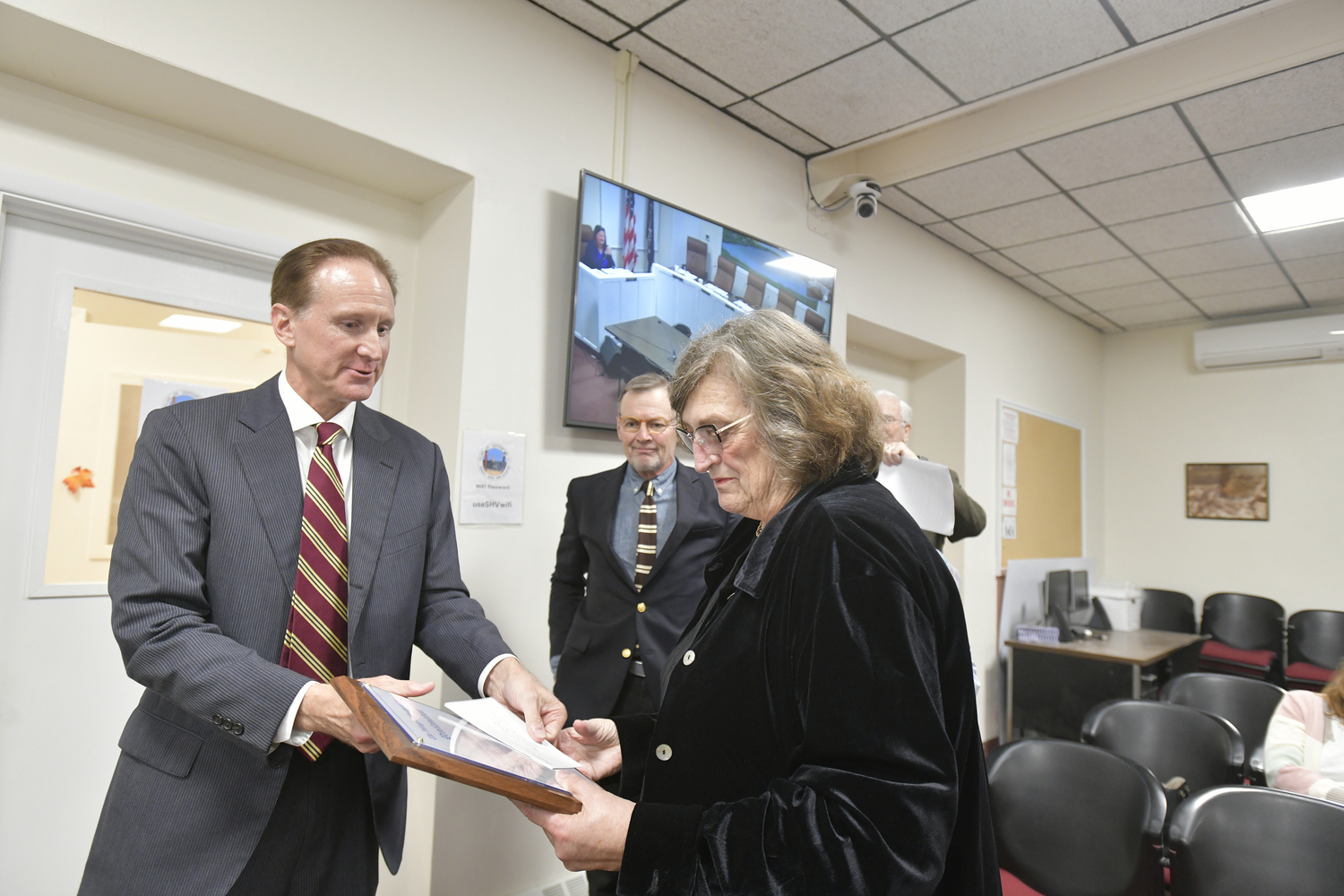 Southampton Village Mayor Bill Manger presents a plaque to long time member of the Planning Commission Pamela Gilmartin. The board of trustees recognized her for her years of service on the commission.   DANA SHAW