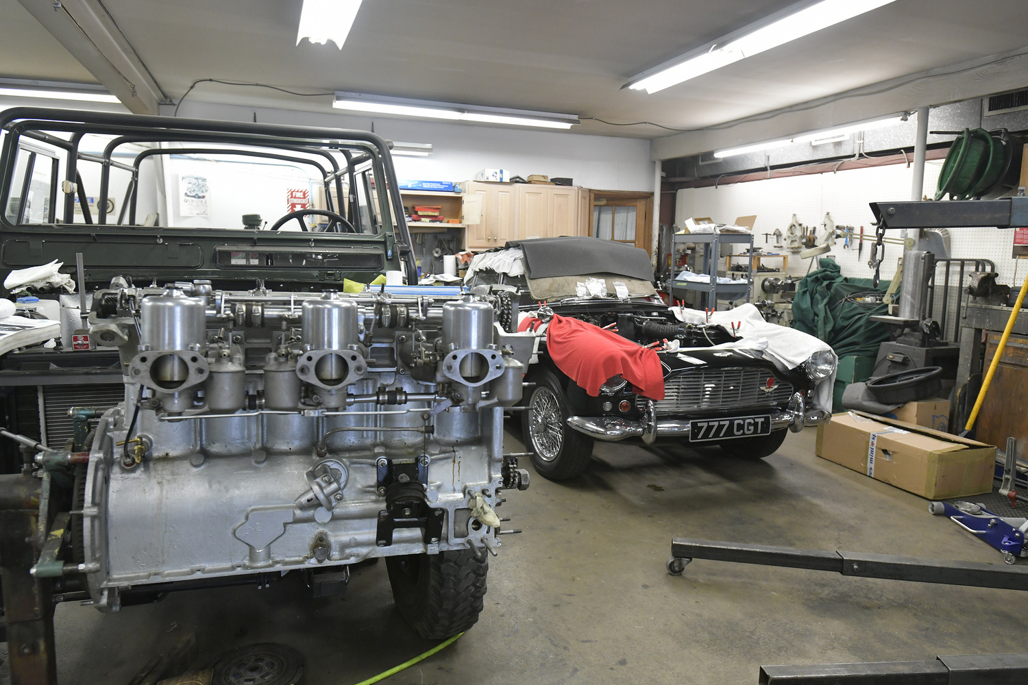 A 1962 Aston Martin DB4 and its engine being worked on at Northumberland Engineering in Southampton.