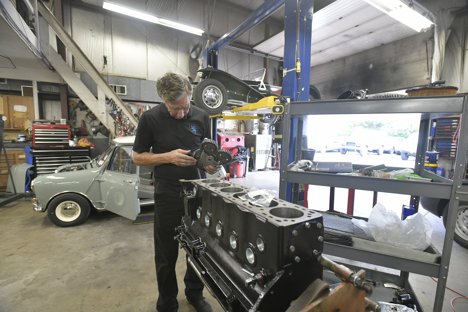 Steve Applebaum works on a 1969 Jaguar E-Type Series 2 engine.