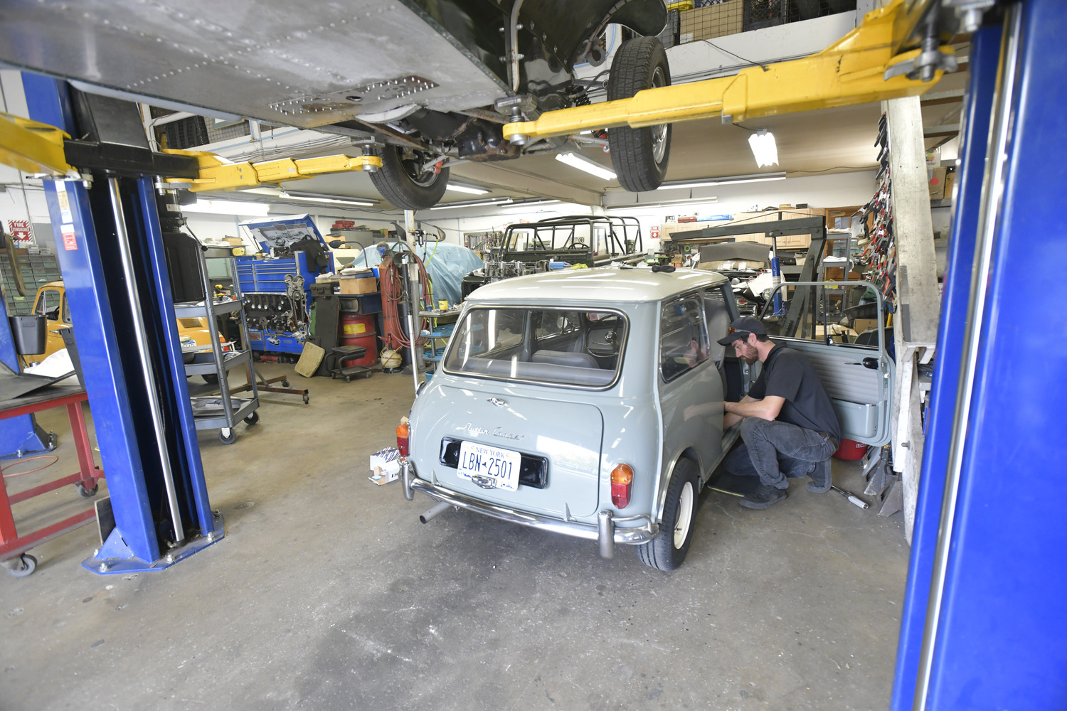 Devin Ficara works on a 1966 Mini Cooper at Northumberland Engineering.  DANA SHAW