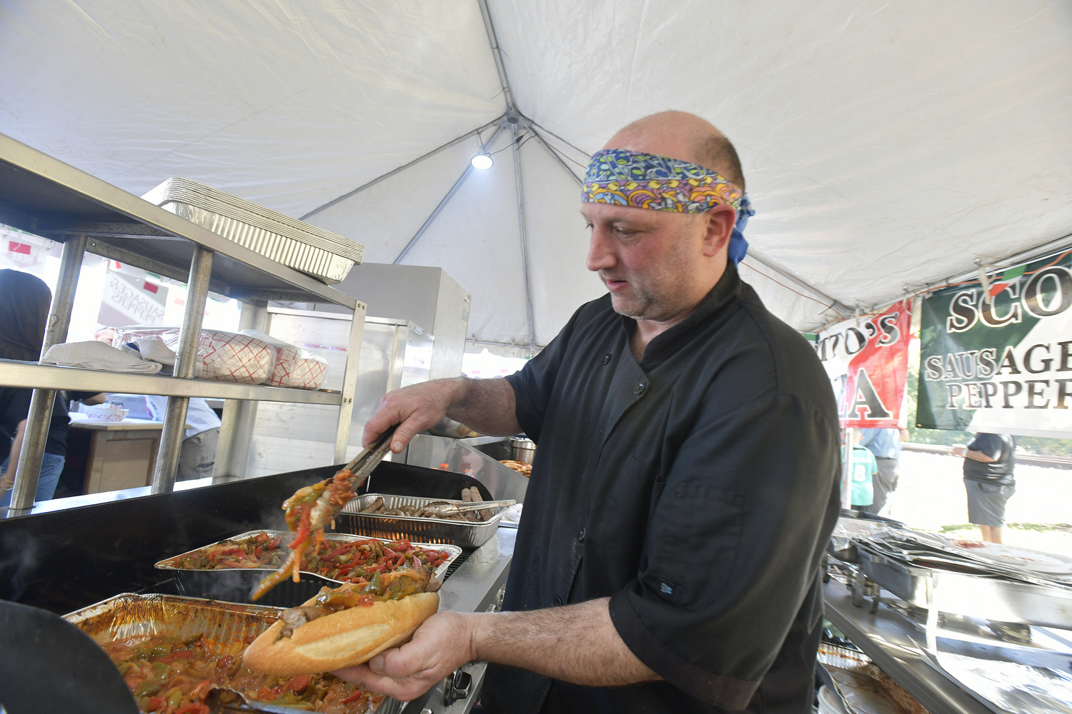 Gary Lattanzio in the Scotto's tent ant the San Gennaro Feast.