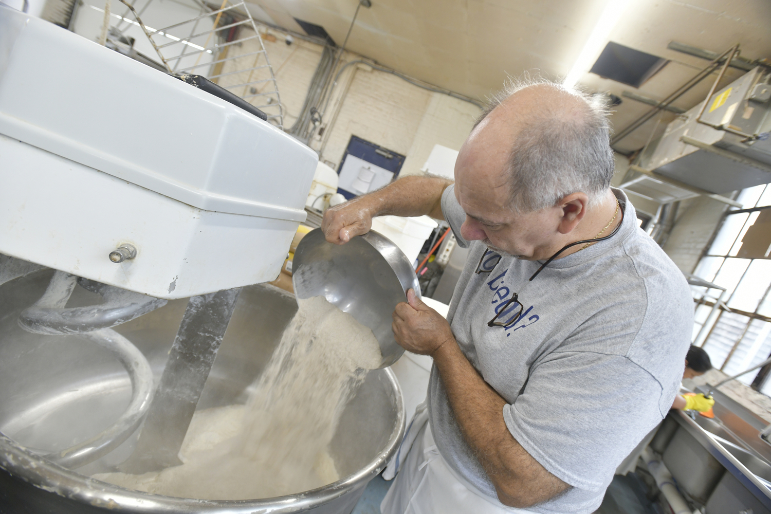 Keith Kouris mixes the dough for sauerkraut bread at the Blue Duck Bakery in Southold.  DANA SHAW