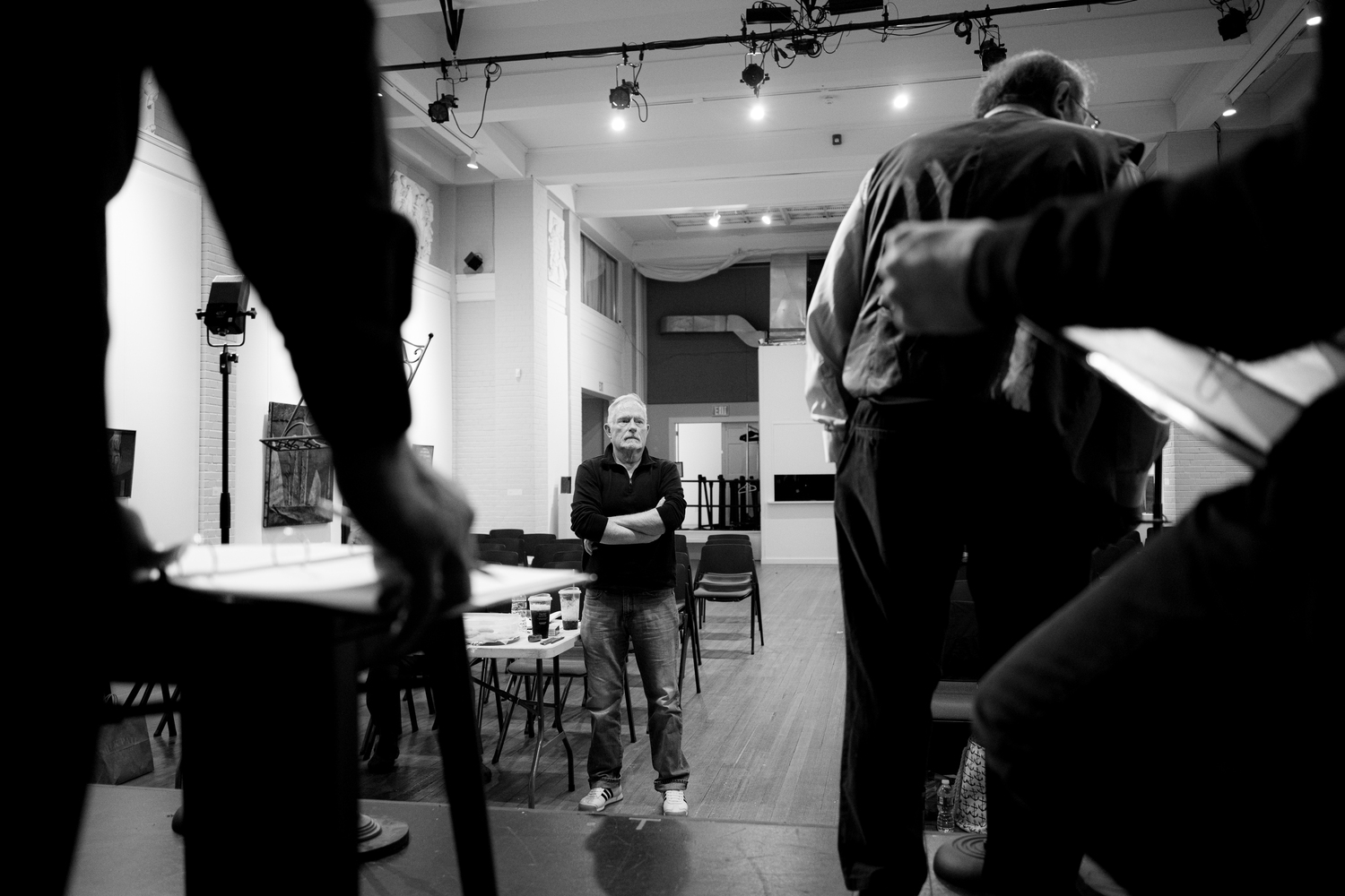 Michael Disher directing the cast of Center Stage's production of “War of the Worlds: The Panic Broadcast” during rehearsals at Southampton Arts Center. DANE DUPUIS