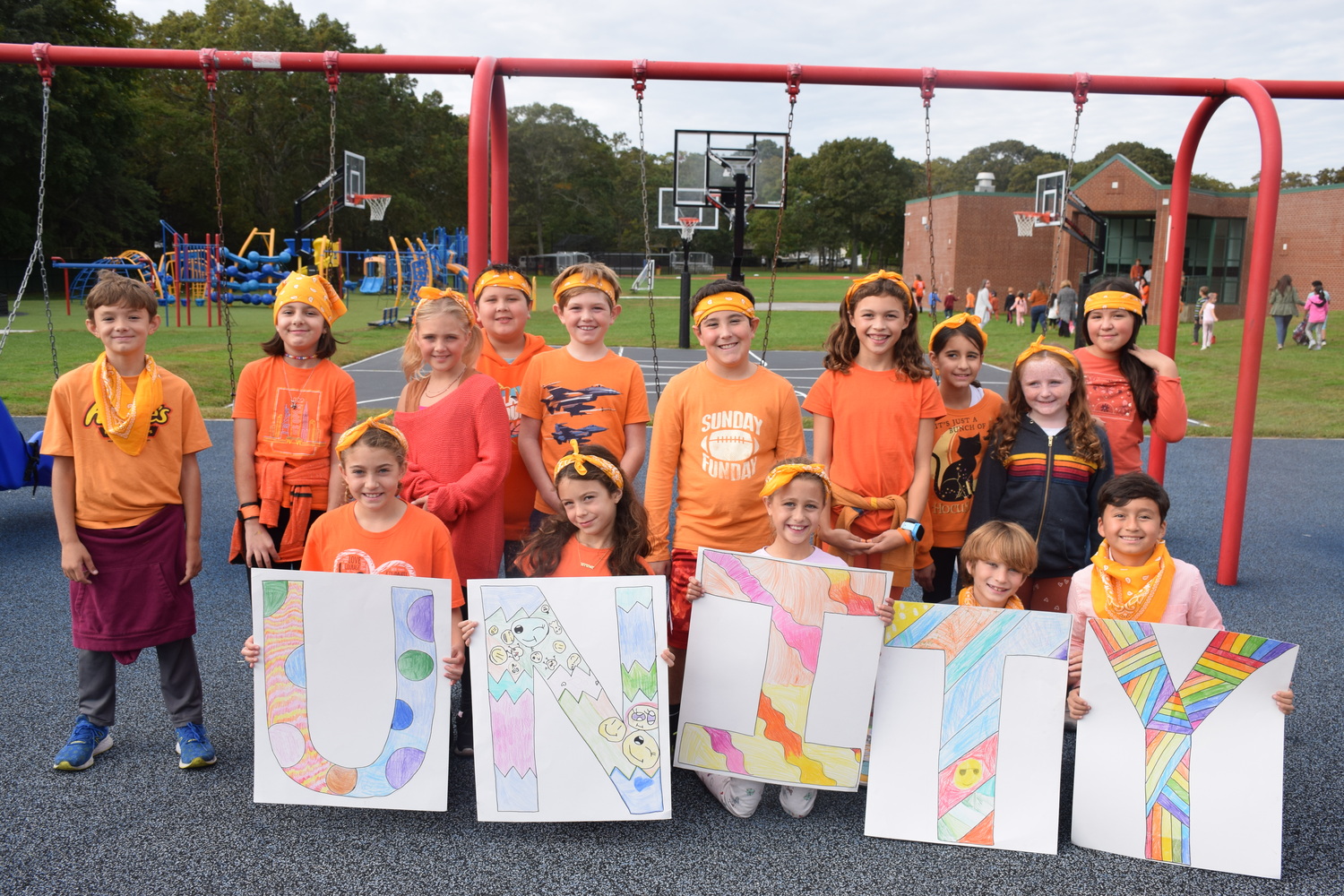 East Quogue students and faculty wore orange on October 18 to show unity for kindness, acceptance and inclusion, while also sending a visible and strong message that no child should ever experience bullying. The school also held its first whole-school meeting in the
amphitheater that was hosted and directed by fourth, fifth and sixth grade students who
encouraged peers to do one good thing for others during the school day. Additionally, select students were acknowledged with certificates for having demonstrated unity during the month of October and were applauded by their peers. COURTESY EAST QUOGUE SCHOOL DISTRICT