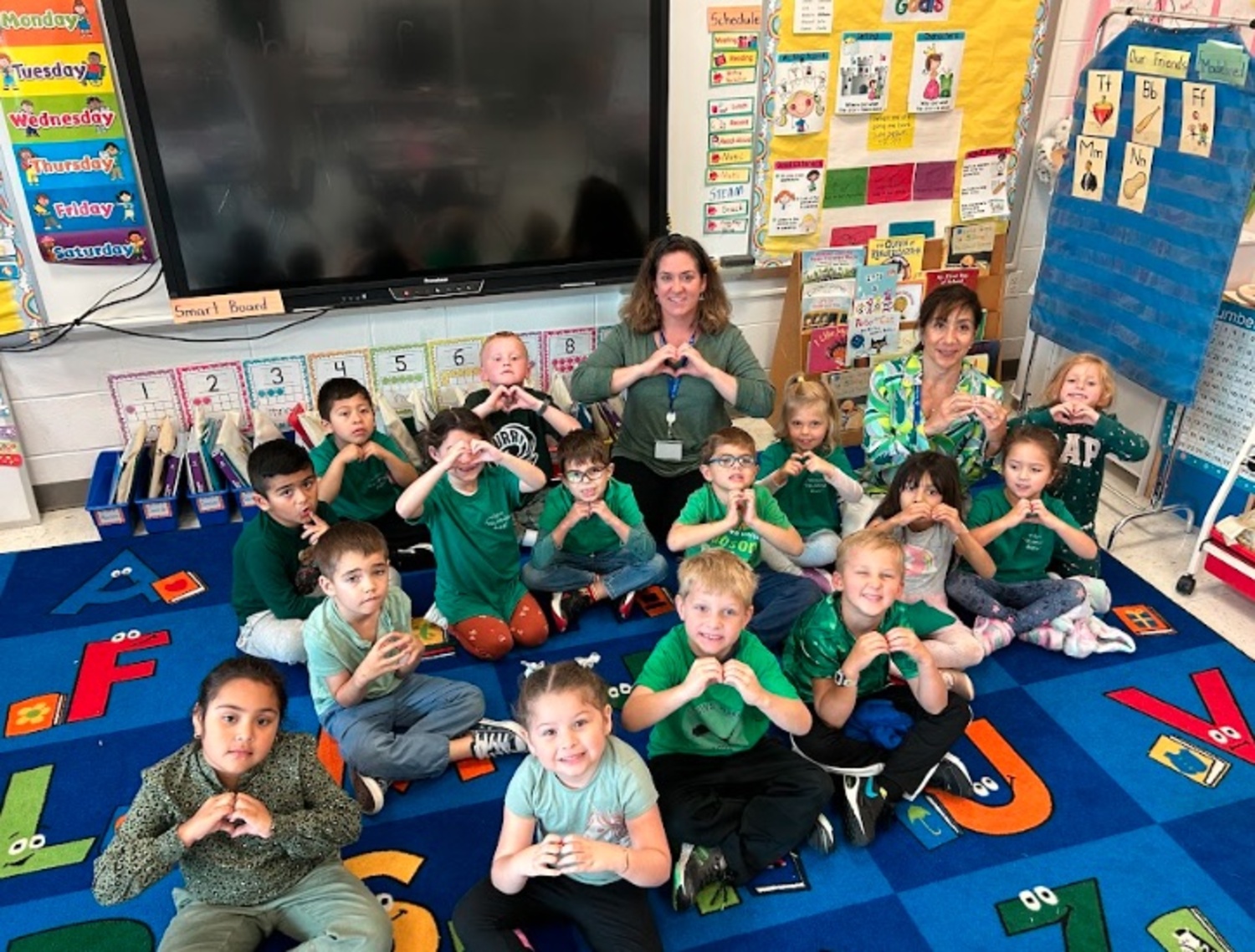 In a show of support to Farmingdale students, faculty and community -- high school students from the district were recently involved in a serious bus crash -- students and staff at East Quogue School District  wore green to school on September 26. COURTESY EAST QUOGUE SCHOOL DISTRICT