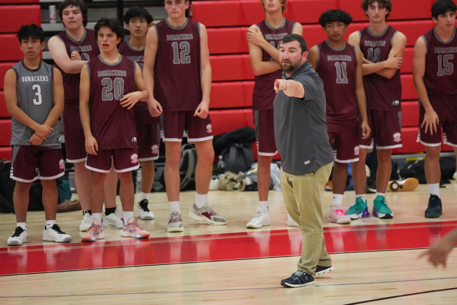 East Hampton assistant coach Andrew Rodriguez directs a player on the court.   RON ESPOSITO