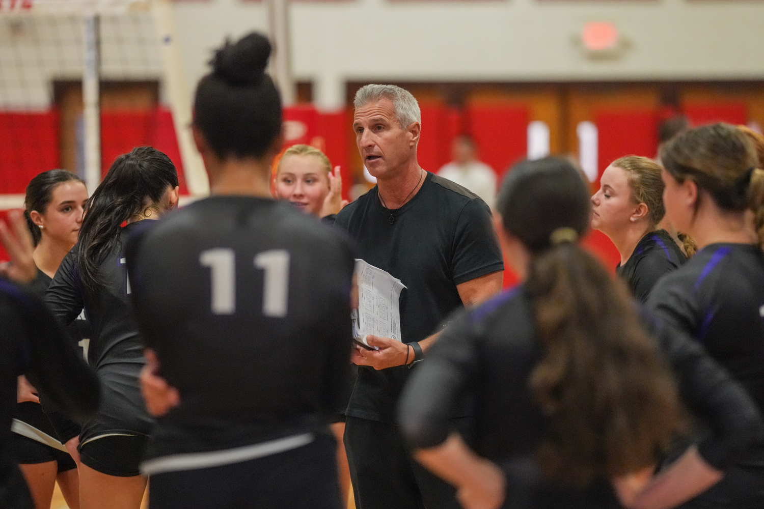 Hampton Bays head coach Andy Fotopoulos talks to his players during a timeout. RON ESPOSITO