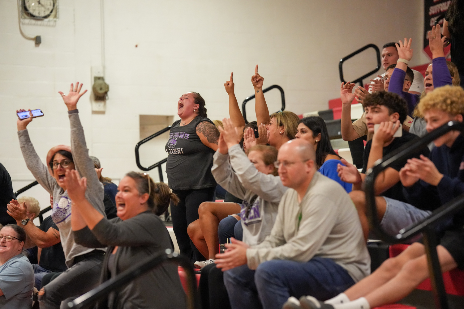 Hampton Bays girls volleyball fans cheer on the Baymen after their third-set win. RON ESPOSITO