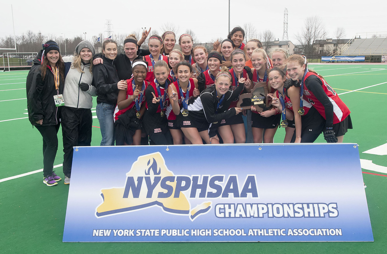The Pierson Lady Whalers after they became New York State Champions following the NYSPHSAA Class C Final field hockey playoff between the Pierson/Bridgehampton Lady Whalers and the Cazenovia Lady Lakers at Cicero High School on November 17, 2013.   MICHAEL HELLER