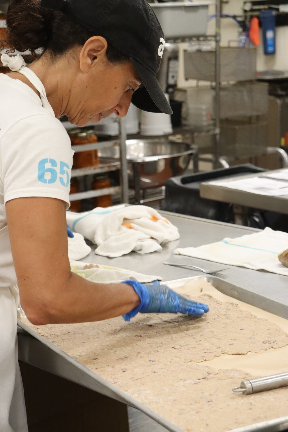 Marilena Anastassiadou making a fresh batch of her sourdough crackers at the East End Food kitchen on the Stony Brook Southampton campus. CAILIN RILEY