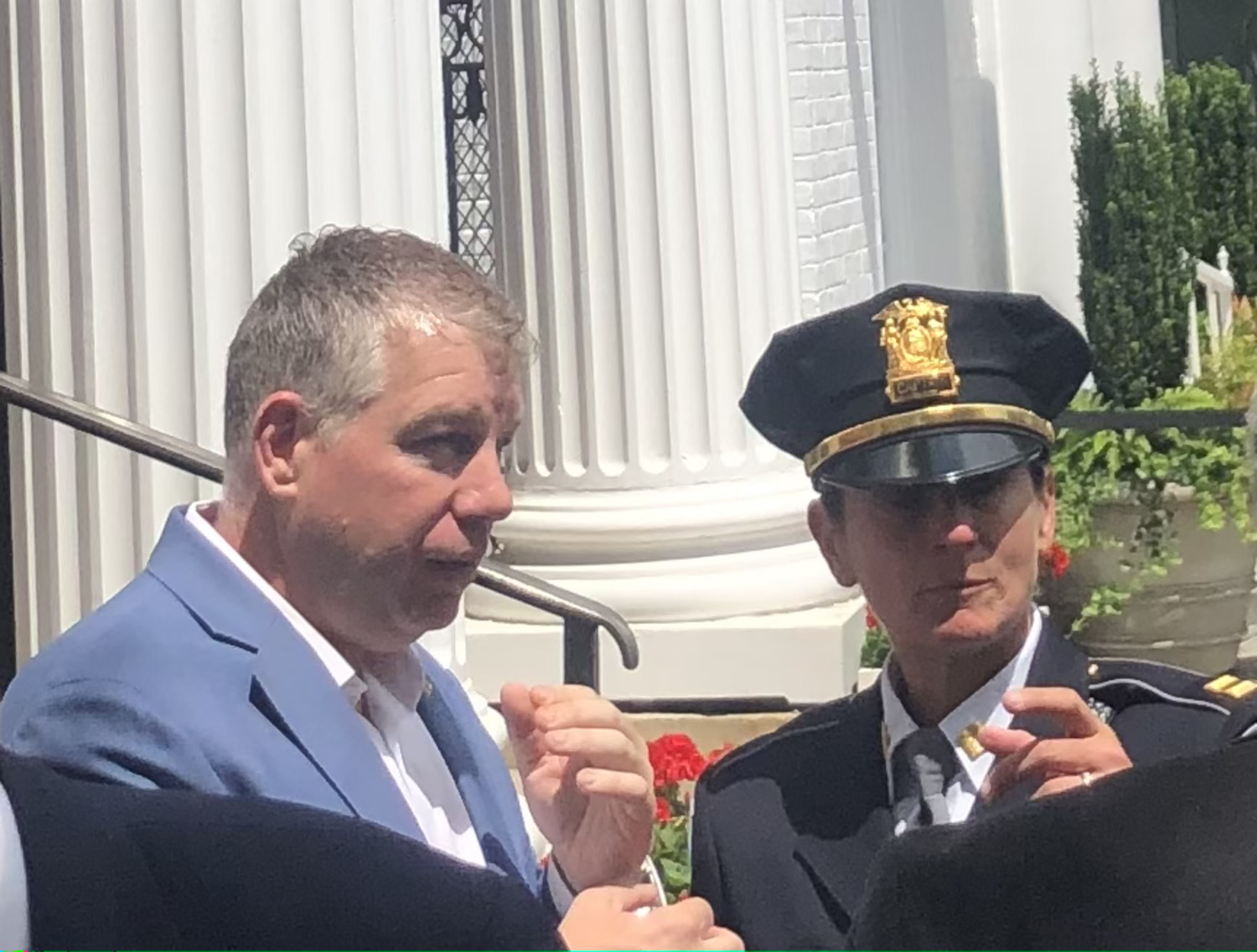 Anthony Carter and Southampton Village Police Chief Suzanne Hurteau on the steps on Village Hall in June. CAILIN RILEY