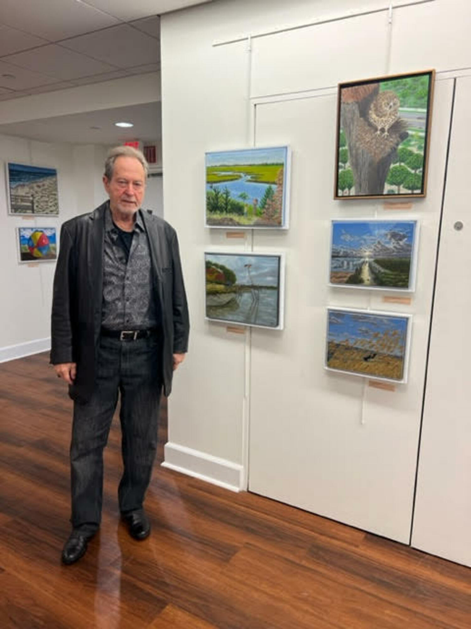 John Melillo with his work at a previous art show at Southampton Cultural Center. COURTESY THE ARTIST