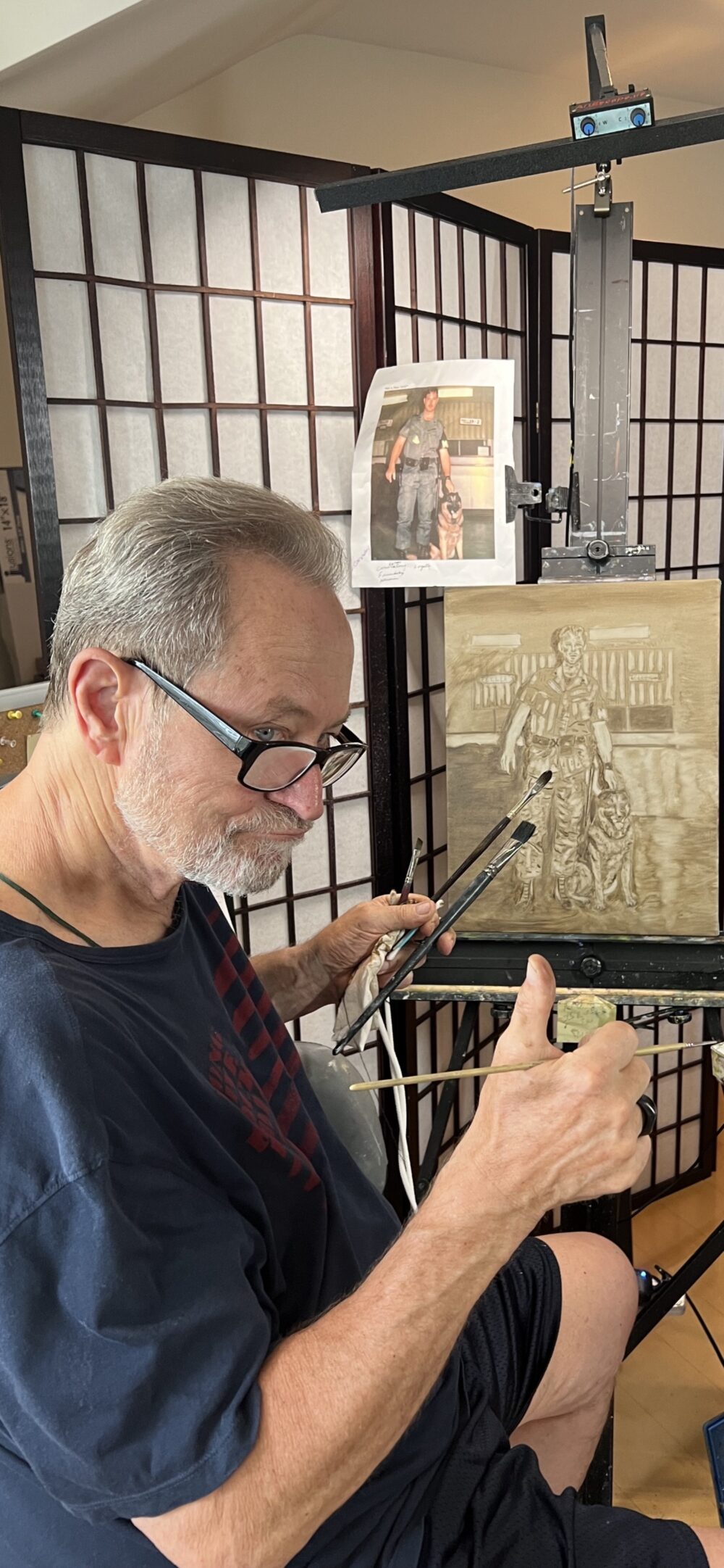 John Melillo painting King, the German shepherd he served with in Vietnam.
