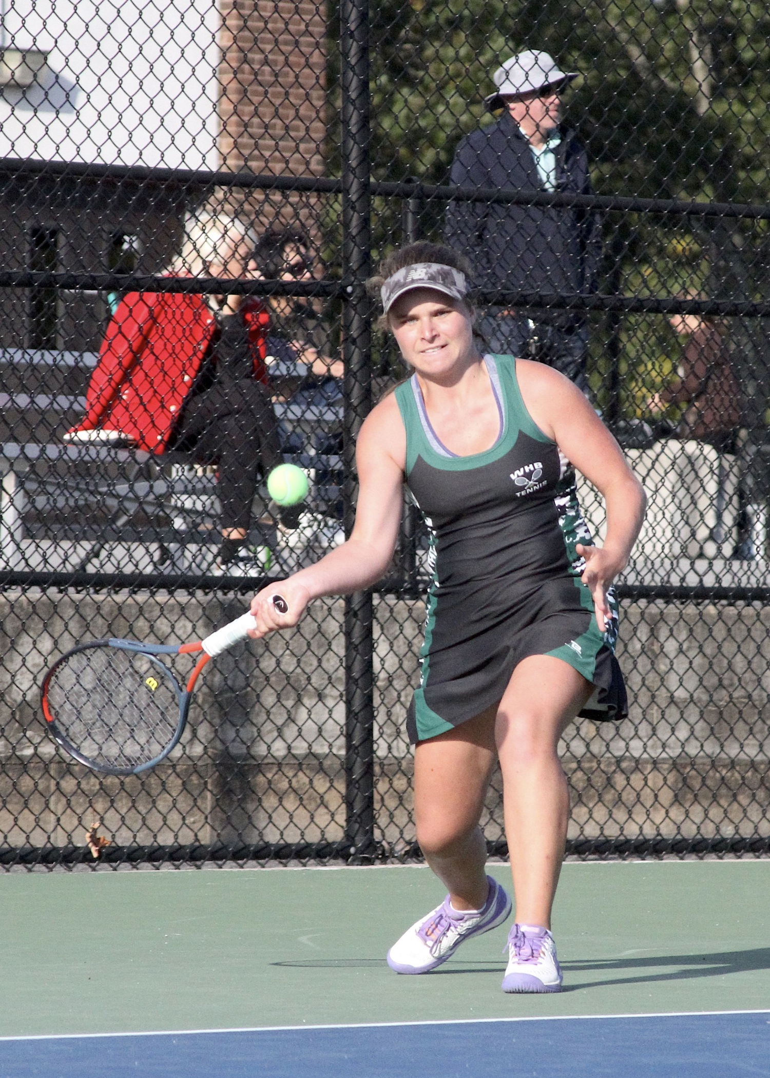 Senior Julia Stabile powers the ball back over the net. DESIRÉE KEEGAN