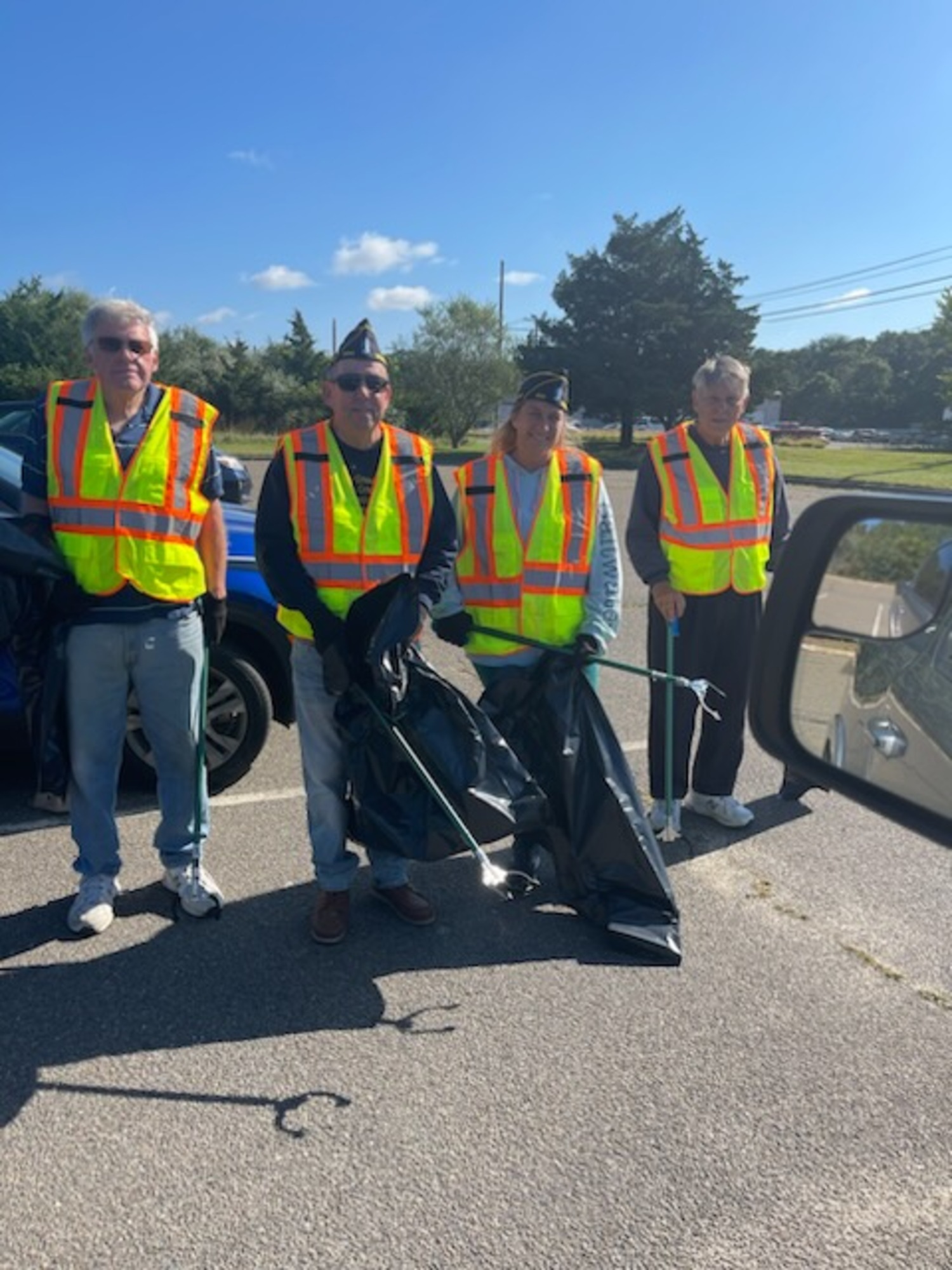 Members of American Legion Post 834 in Westhampton Beach recently  turned out to clean its designated portion of Montauk Highway in the Adopt a Highway program. From left, George Motz, Tom Quinn, Lisha Catt, and Tom Hadlock. COURTESY PAUL HAINES