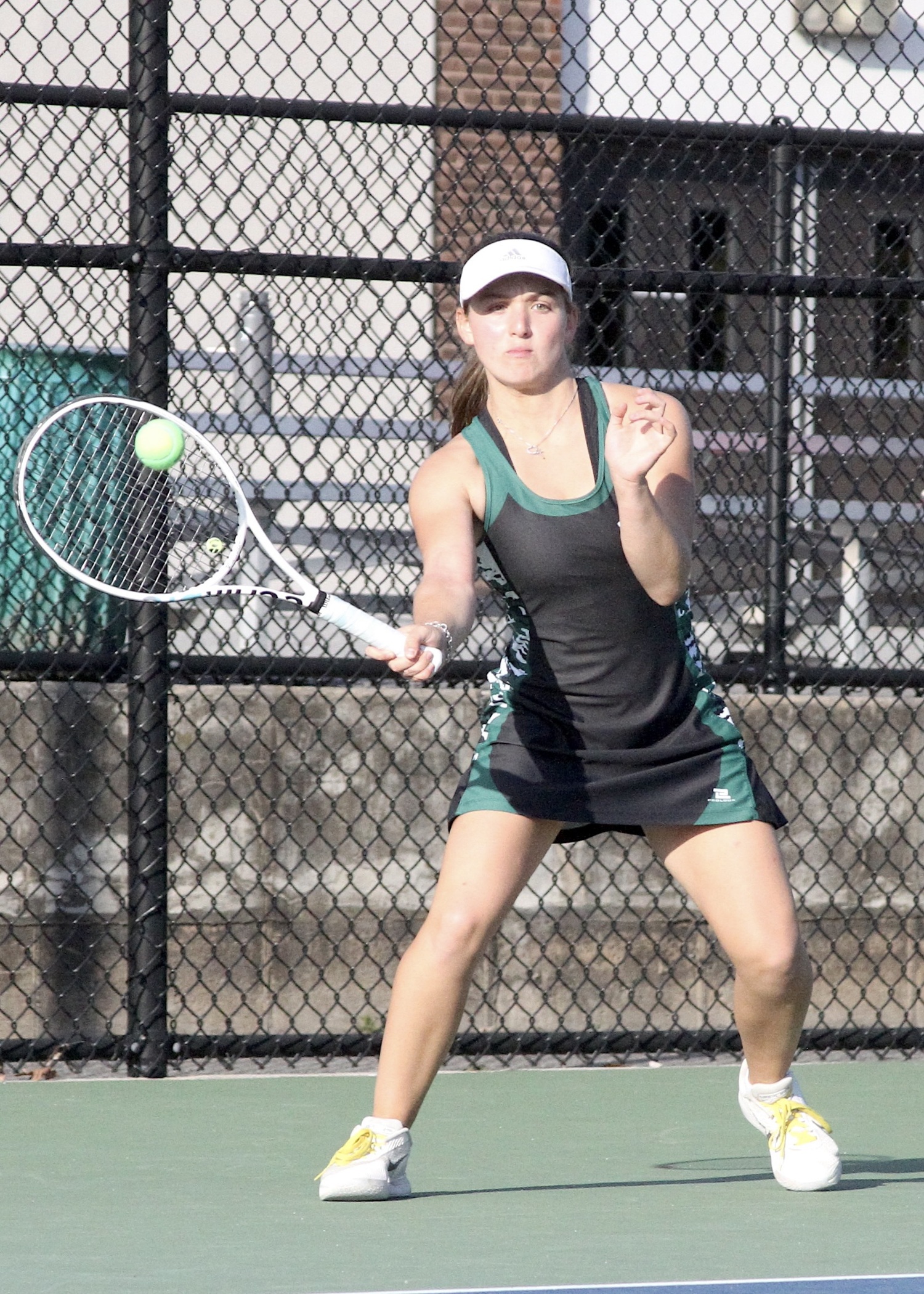 Junior Matilda Buchen returns a serve. DESIRÉE KEEGAN