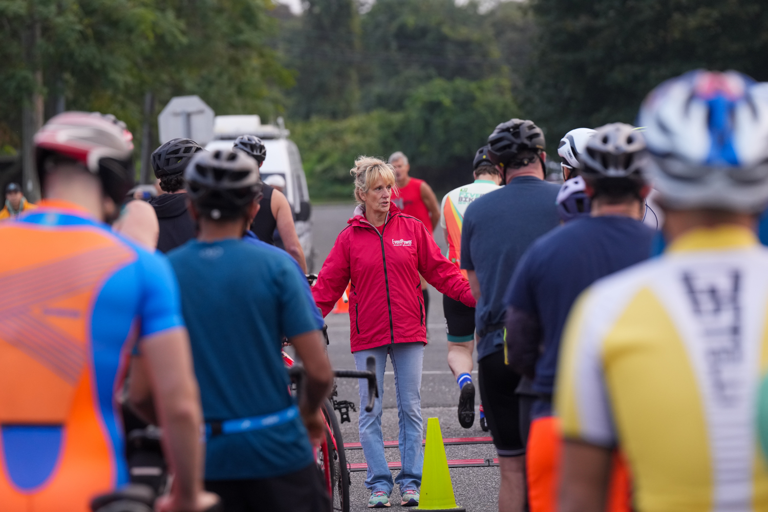A member of EventPower, the organizer for the race, speaks.   RON ESPOSITO