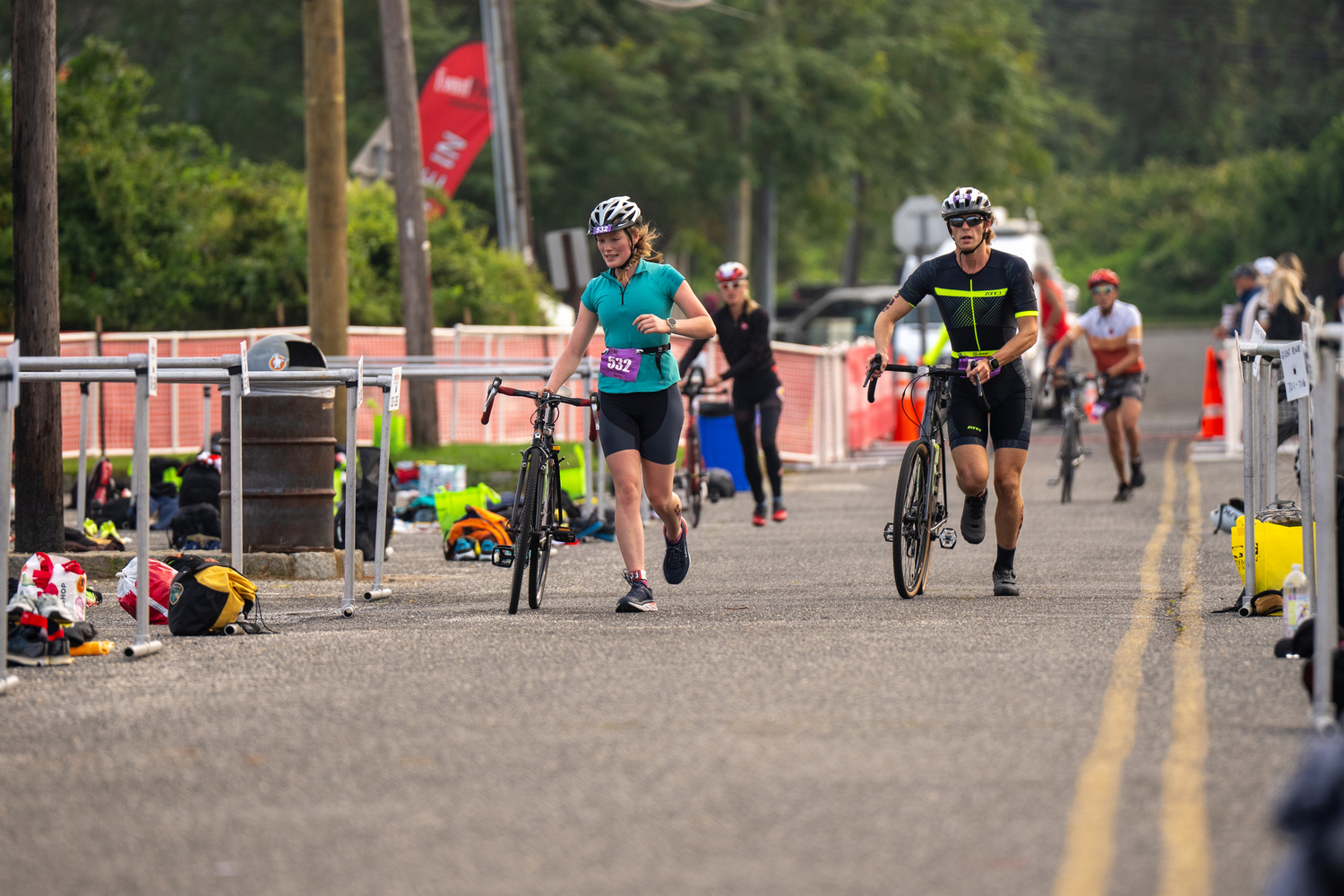 Triathletes come in to finish the bike portion.  RON ESPOSITO