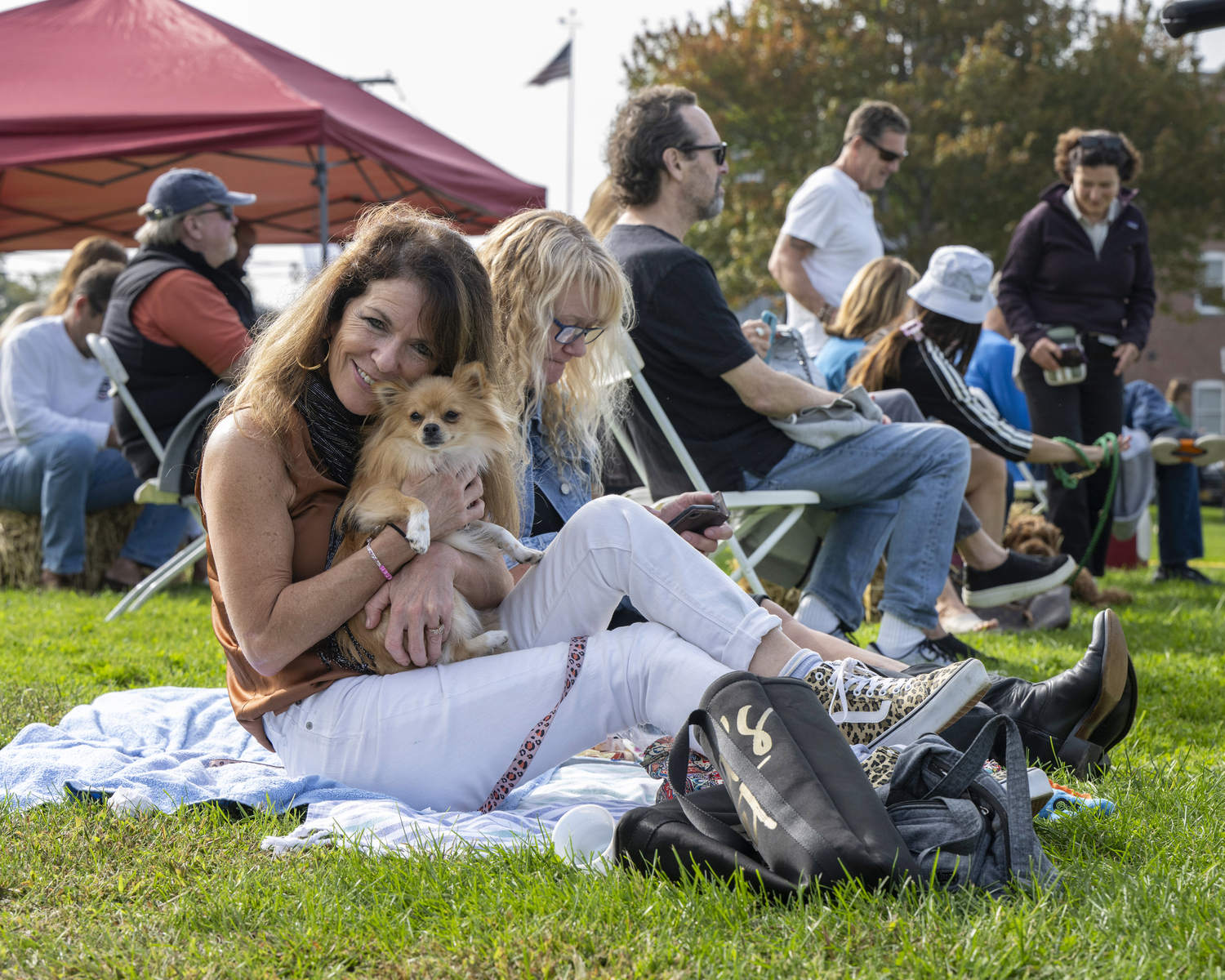 Enjoying music with a friend at the Sag Harbor American Music Festival on Sunday.