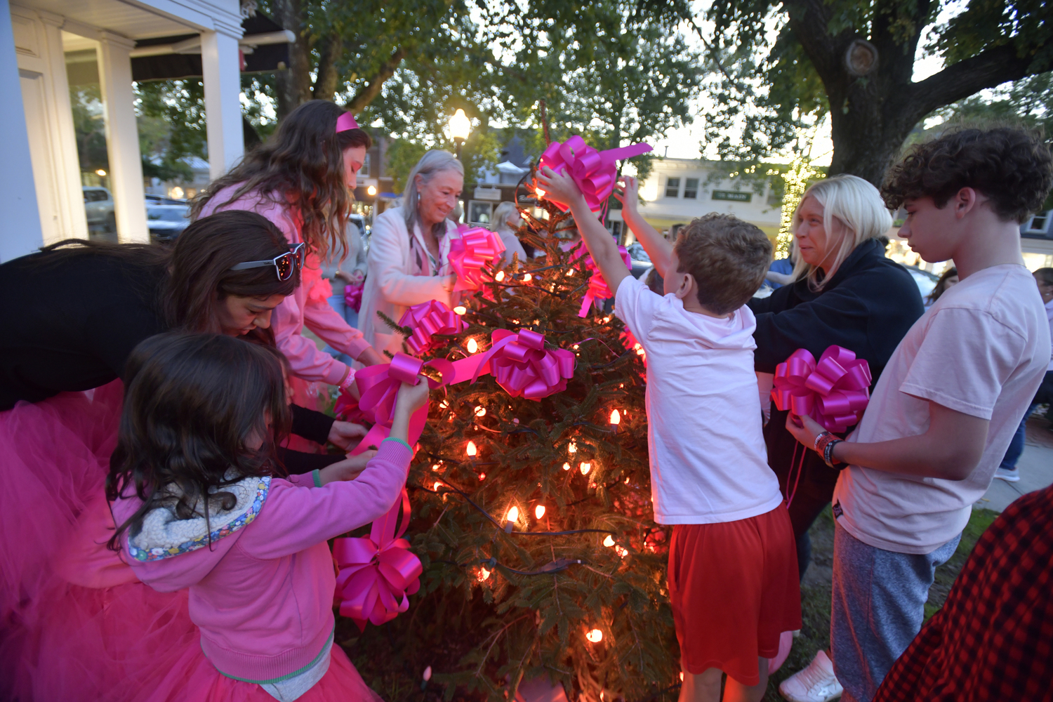 In honor of Breast Cancer Awareness Month in October, Lucia's Angels and the Coalition of Women's Cancers, along with the Southampton Chamber of Commerce, lit and decorated the pink tree at the Chamber building on Main Street in Southampton Village on October 2.  DANA SHAW
