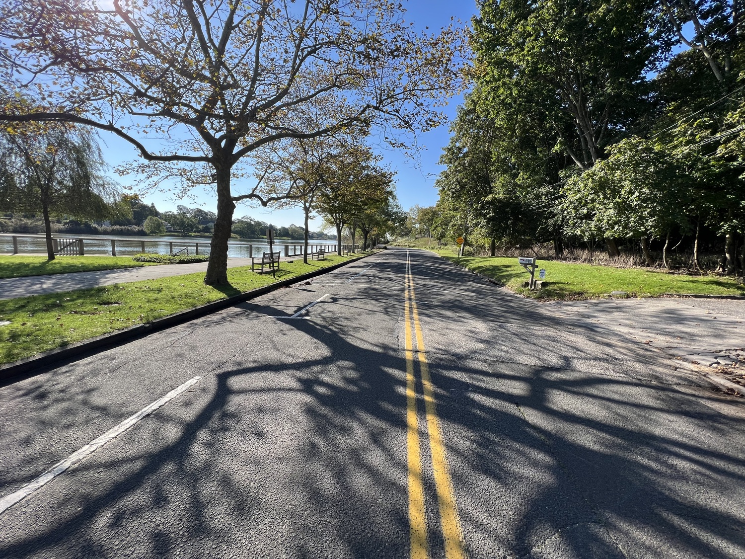 The Lake Agawam Conservancy proposes closing Pond Land to motor vehicle traffic as part of a plan to build a new public park and reduce runoff into the lake.  DANA SHAW