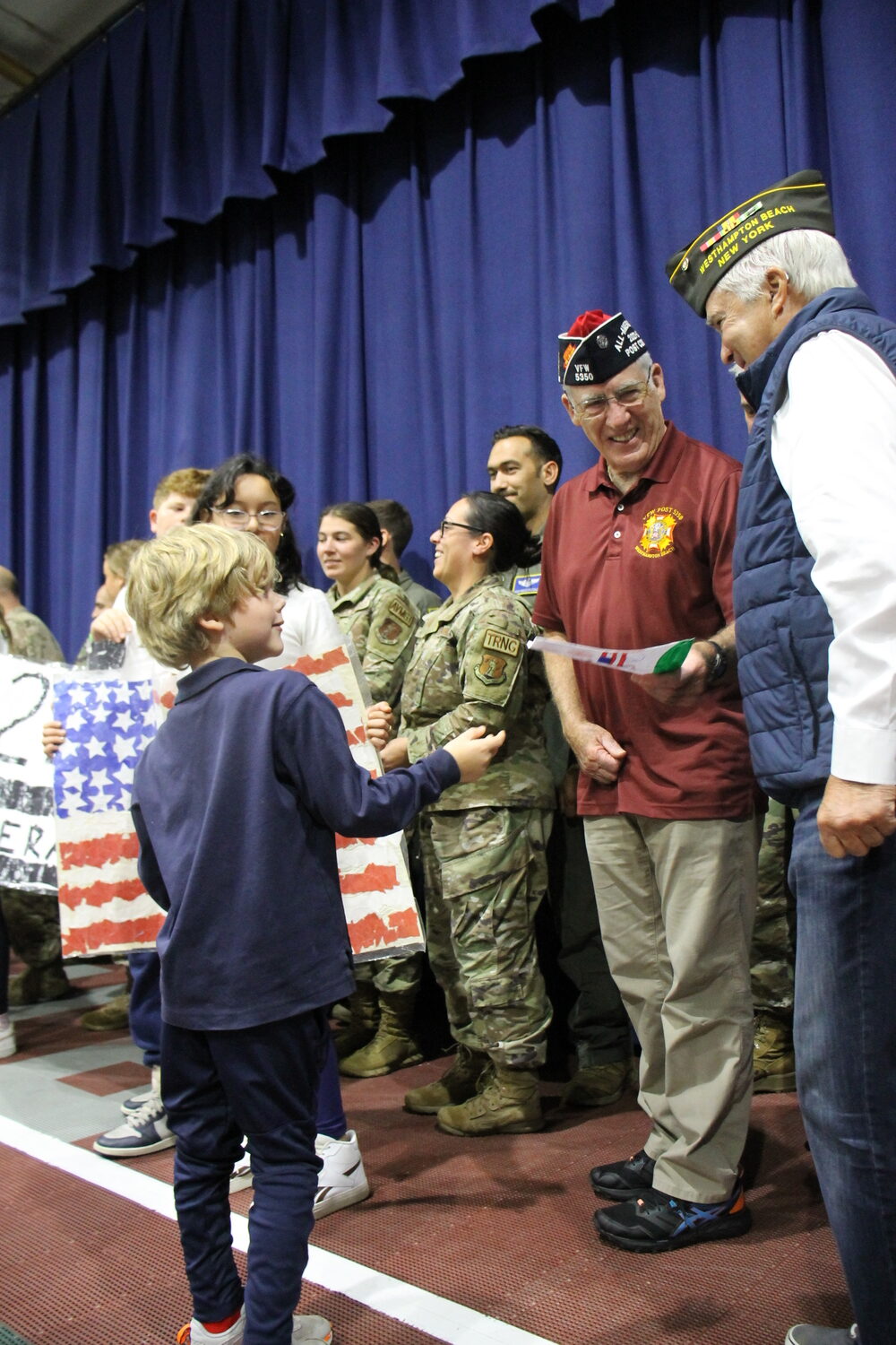 Raynor Country Day School invited members of  VFW Post 5350 and the 106th Rescue Wing to a march on October 20 to bring awareness to the alarming suicide and PTSD rate in our Veteran community. There were 142 enthusiastic students, staff, guests and veterans participating. COURTESY BILL HUGHES
