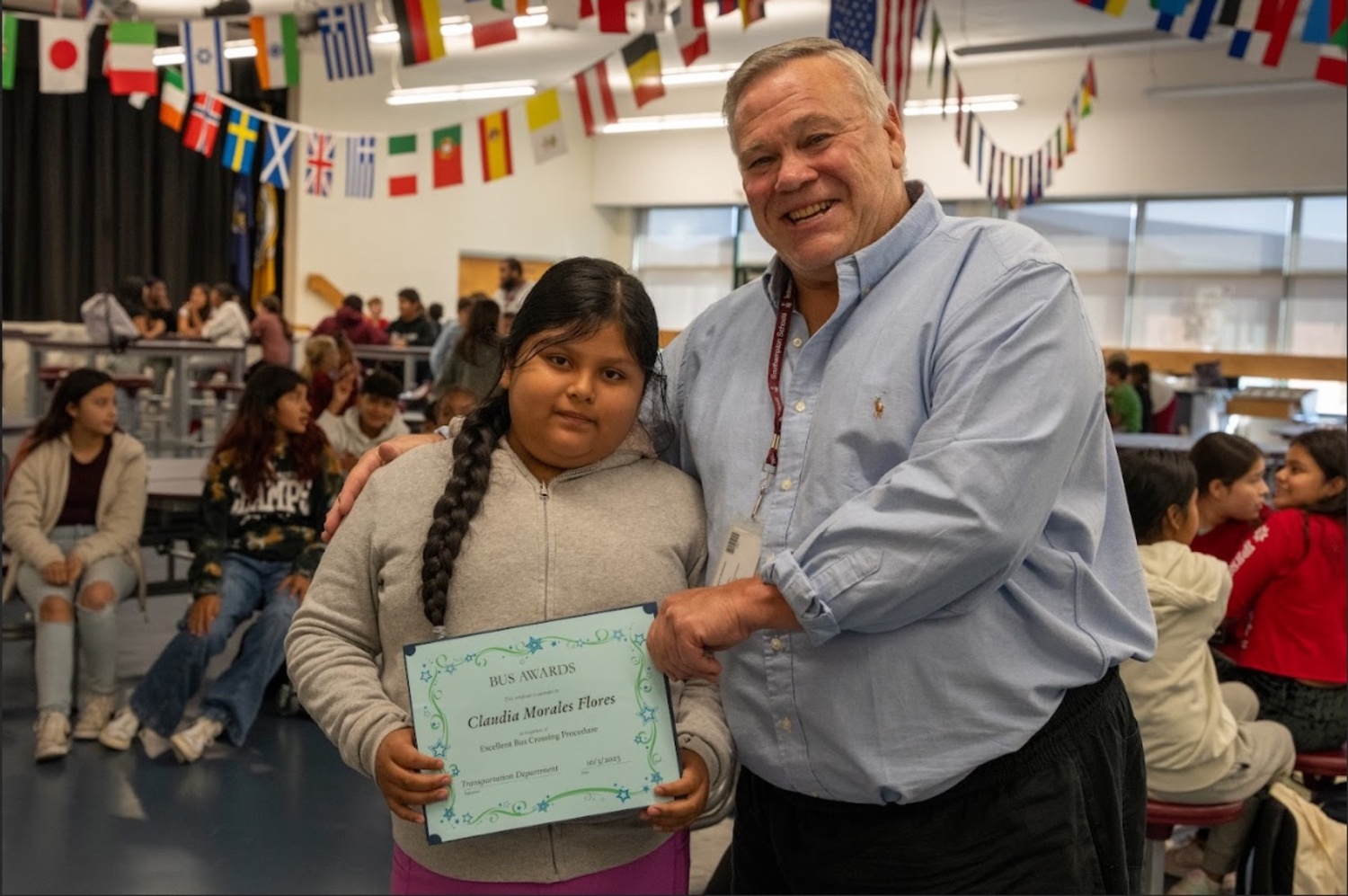Southampton Intermediate School sixth grader Claudia Morales and her bus driver Rick Berkowski were recently recognized for following important bus safety procedures. Berkowski consistently reminds students that they must wait for a crossing signal from a bus driver before crossing the street to a bus. Morales did just that recently when Berkowski noticed a passing car that was not yielding to the flashing lights and the bus stop sign. Morales exhibited great listening skills and waited for Berkowski’s signal, ensuring her safety. COURTESY SOUTHAMPTON SCHOOL DISTRICT