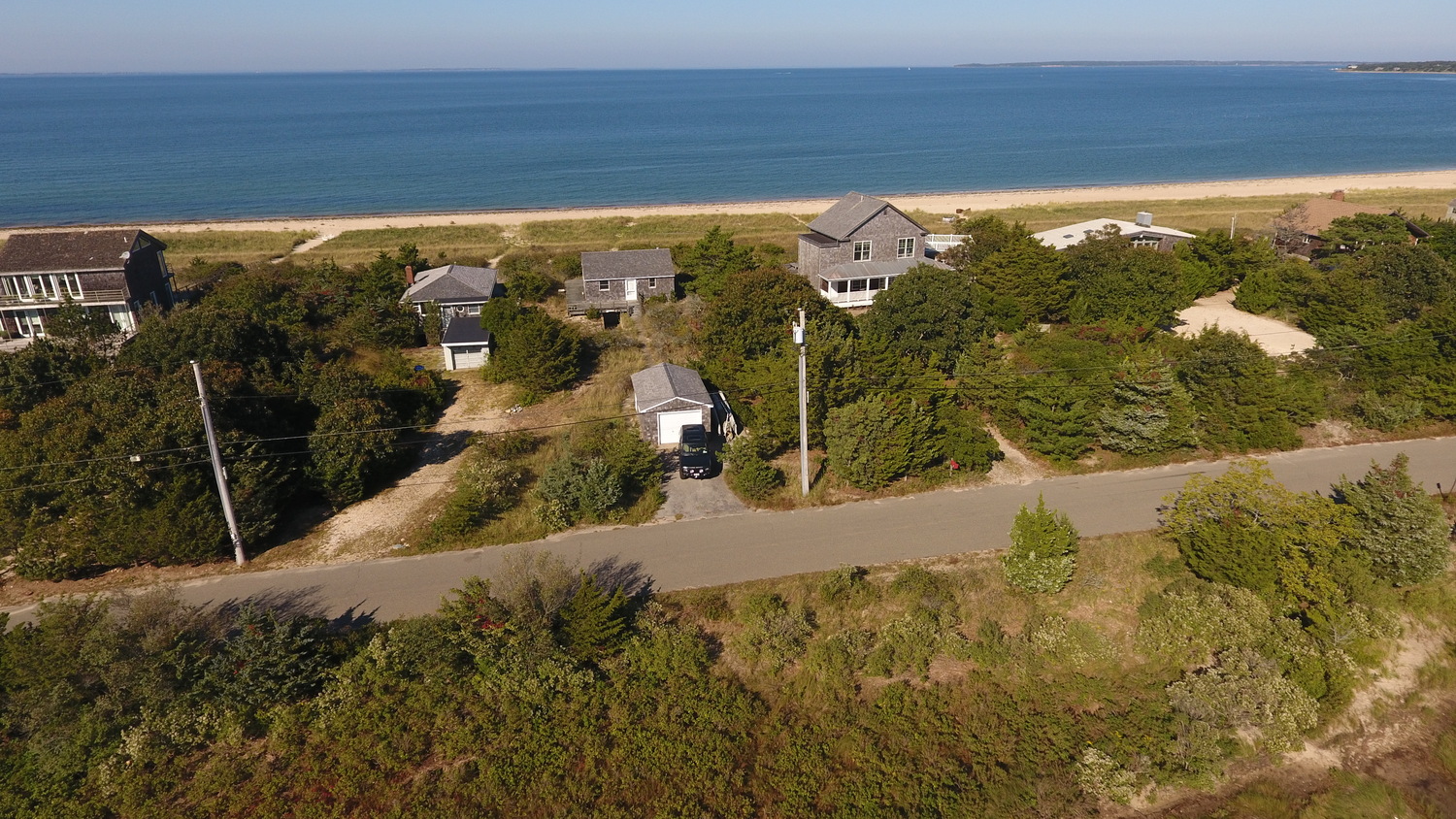 The owners of three small cottages on Sammys Beach Road have proposed razing all three and building a single new 2-story home. The proposal has outraged neighbors who say the new house is outsized for the neighborhood. 
MICHAEL WRIGHT