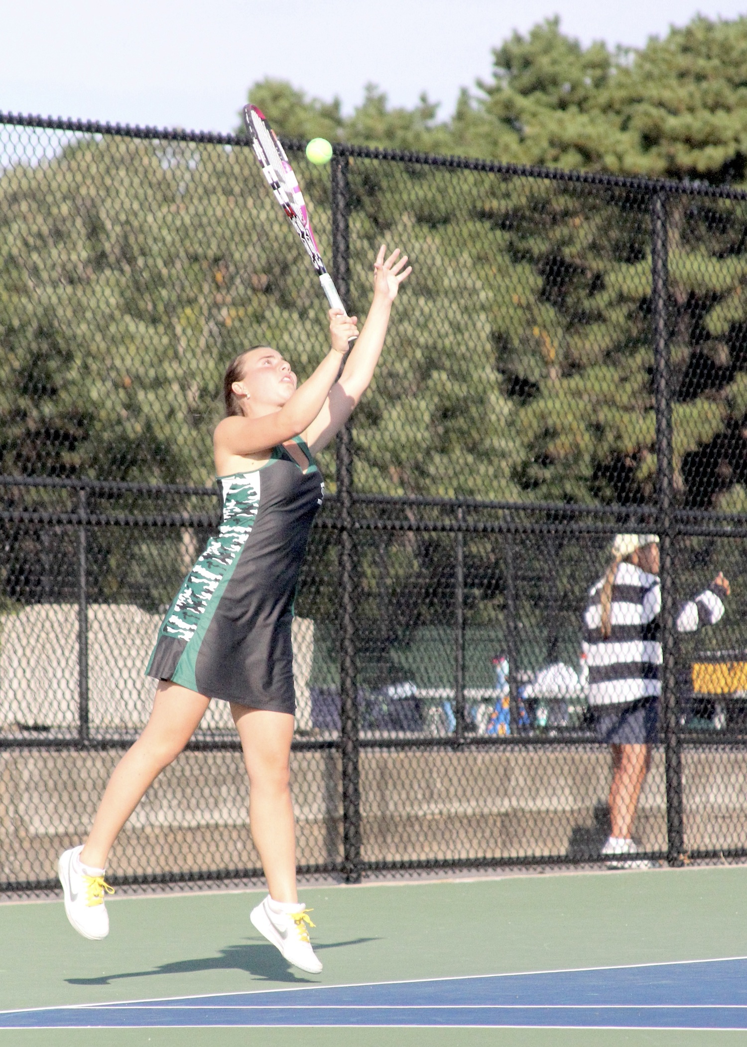 Senior Taylor Lagattolla serves. DESIRÉE KEEGAN