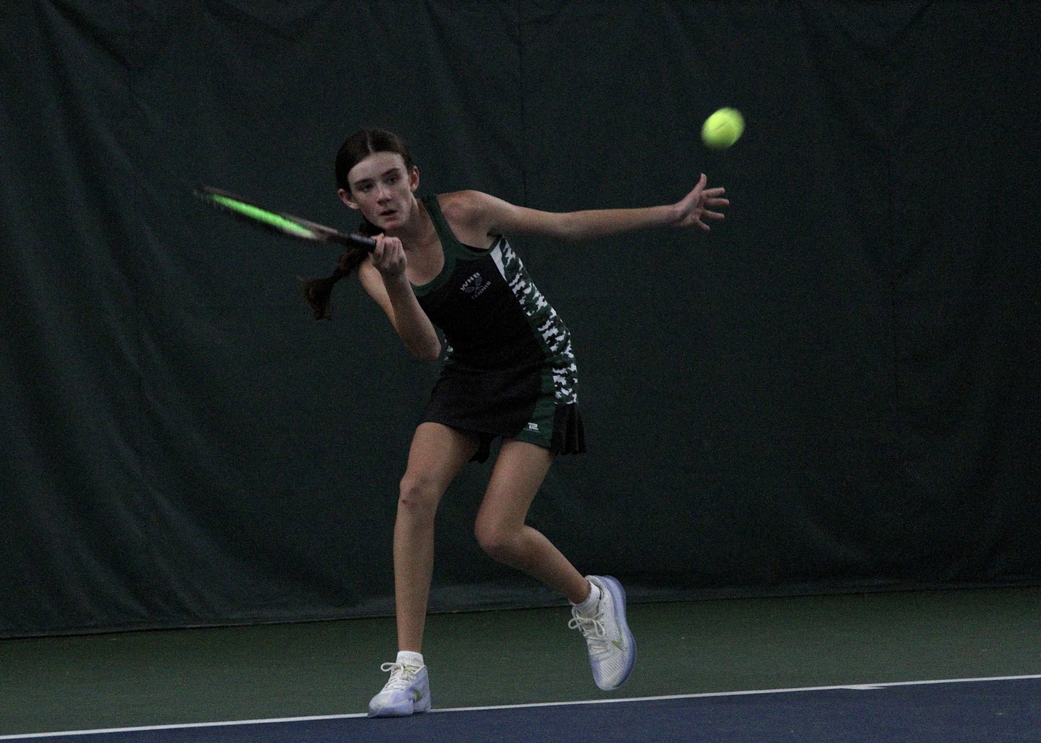 Eighth-grader Ava Borruso powers the ball across the court. DESIRÉE KEEGAN