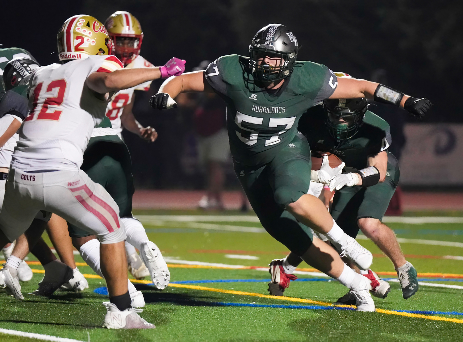 Nolan Michalowski runs behind senior lineman Gabriel Blowes.   RON ESPOSITO