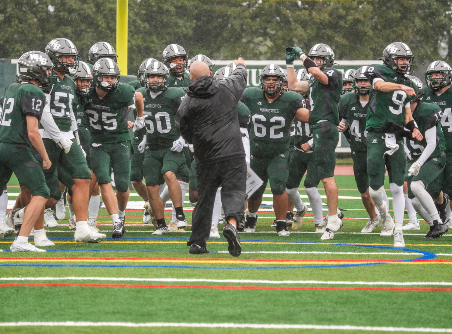Westhampton Beach offensive coordinator Mark Johnson and the Hurricanes are fired up after finishing up their victory on Saturday morning.   RON ESPOSITO