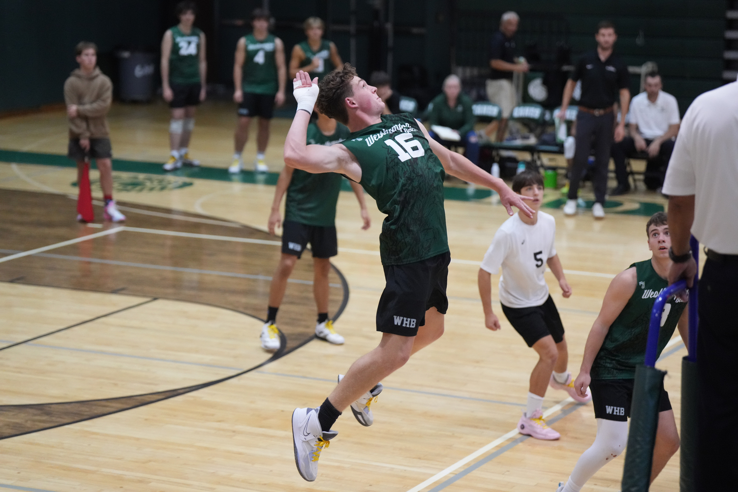 Senior outside hitter Will Jankowski leaps up to spike the ball. RON ESPOSITO