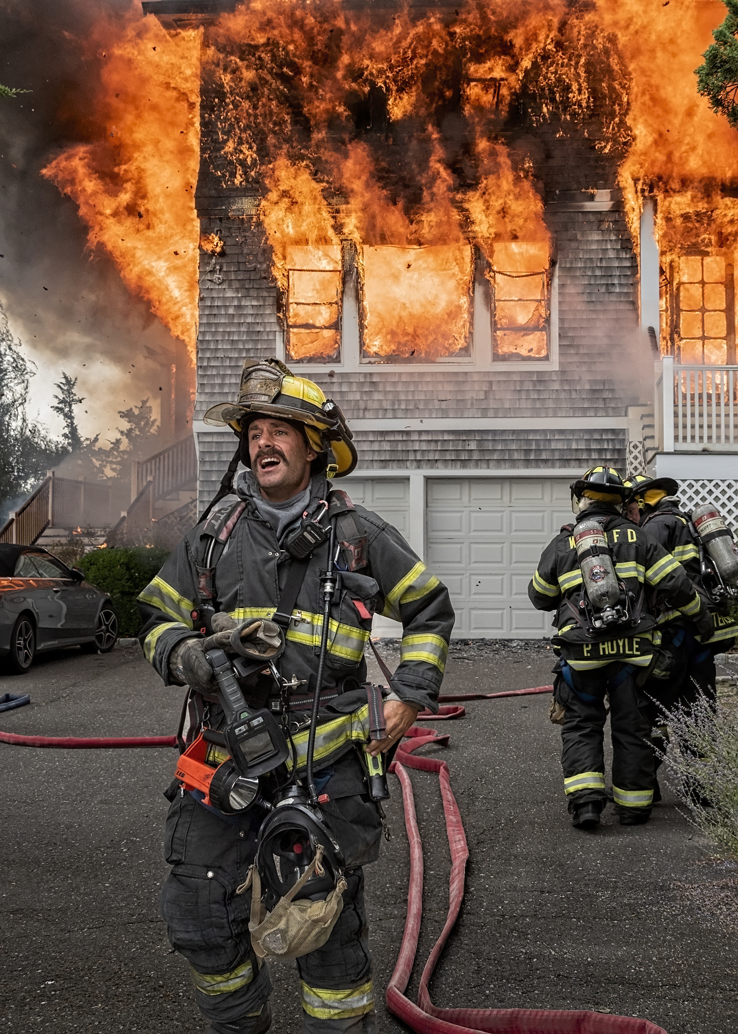 A Westhampton Beach firefighter at the scene of a fire that destroyed a home on East Division Street in the village on Sunday. JOHN NEELY
