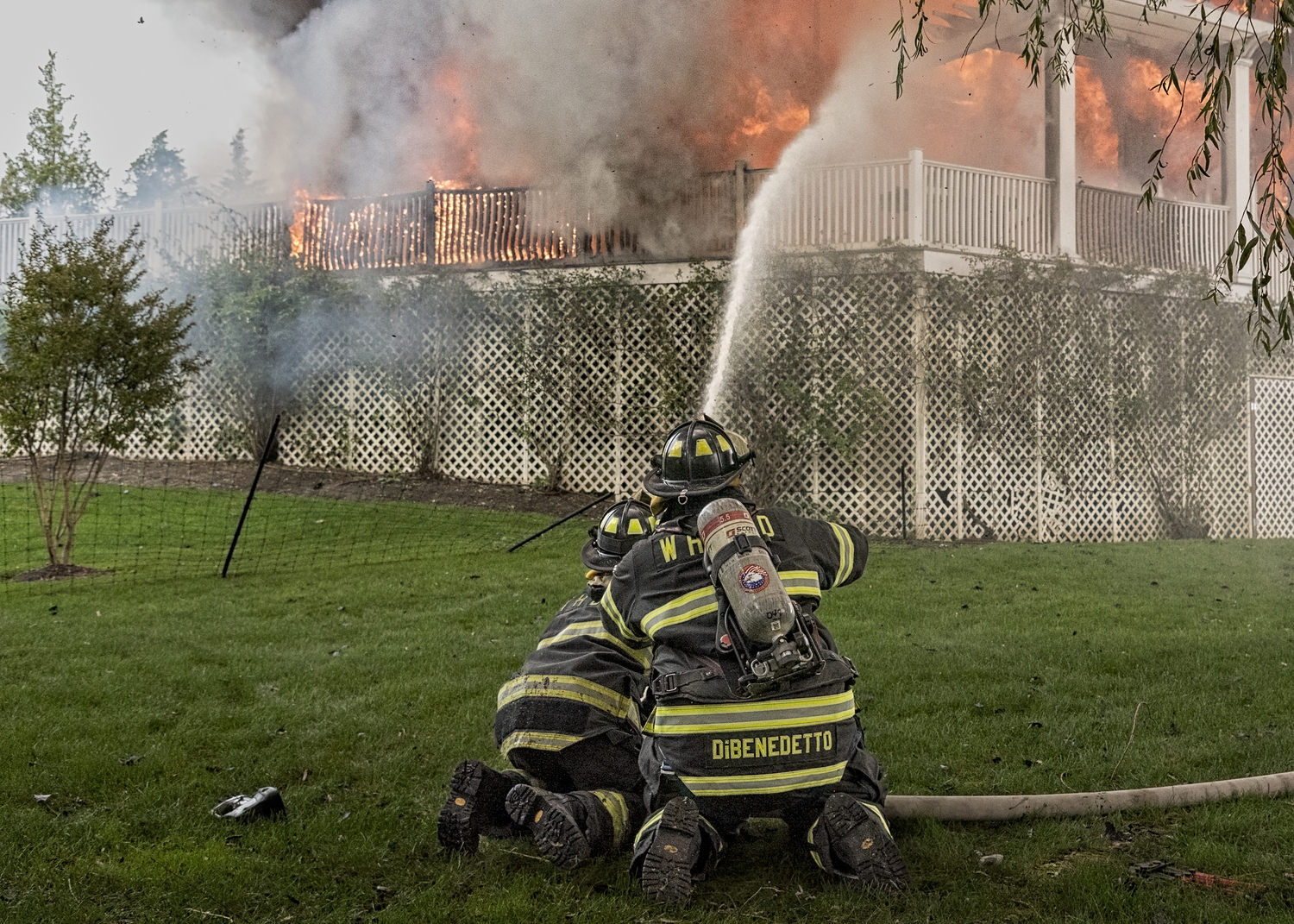 Firefighters battled a fire that destroyed a house on East Division Street in Westhampton Beach on Sunday, October 1. JOHN NEELY