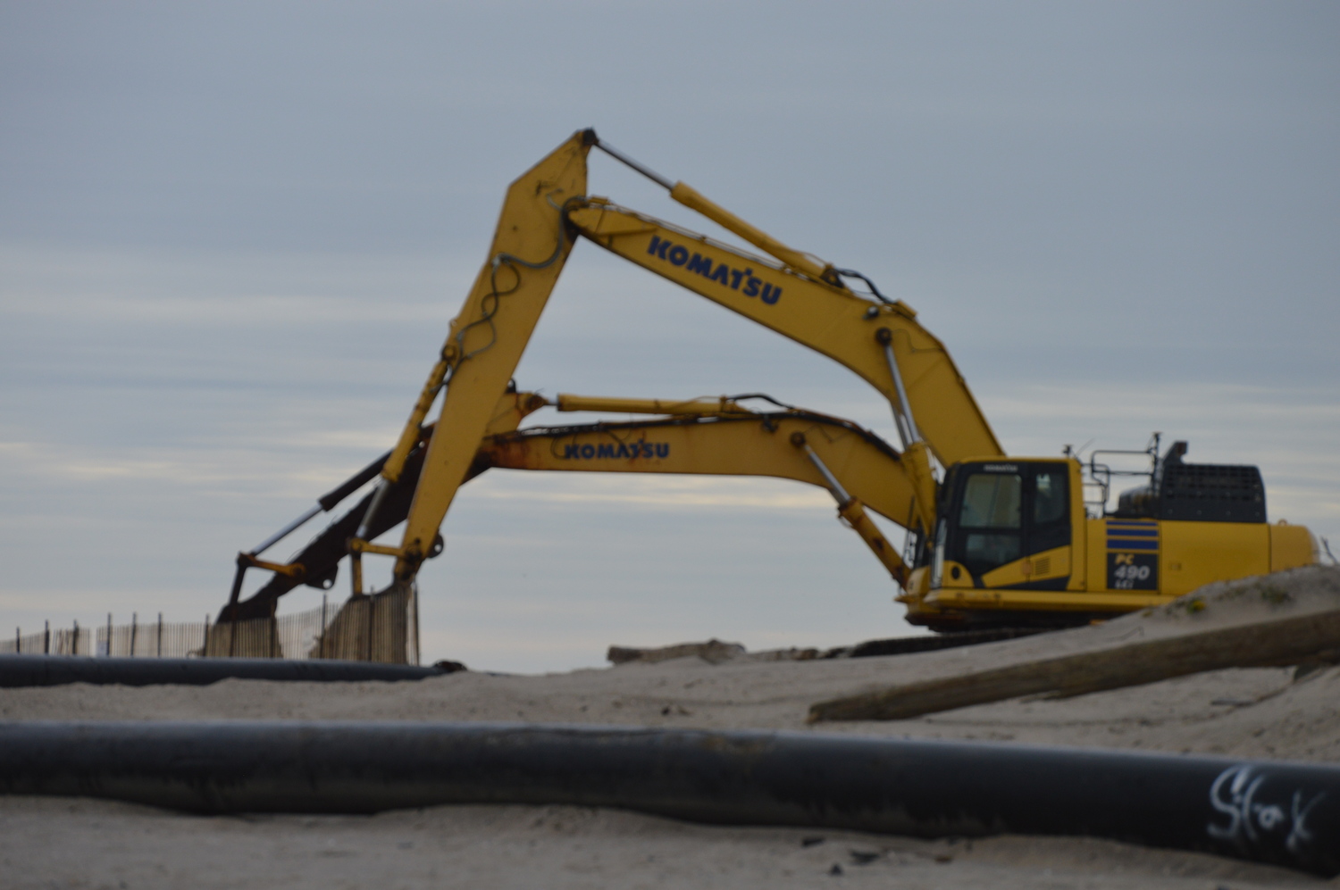 Heavy equipment is out in force for sand-replenishment project underway at Shinnecock Inlet. TOM GOGOLA