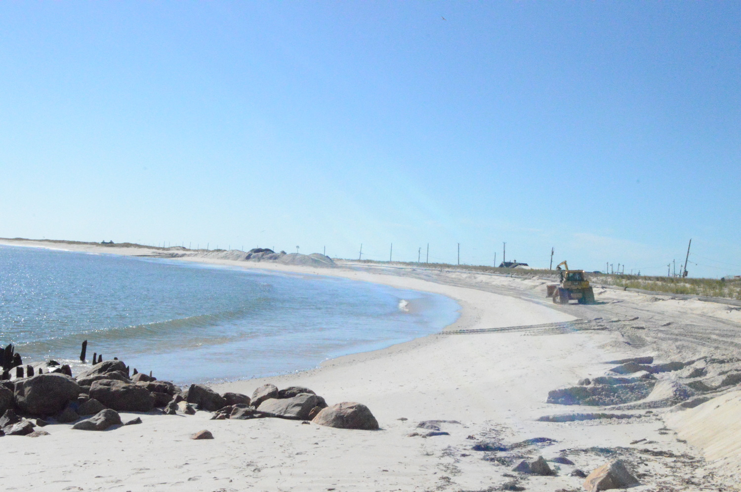 A bulldozer at work during ongoing sand-replenishment project now underway west of Shinnecock Inlet. TOM GOGOLA