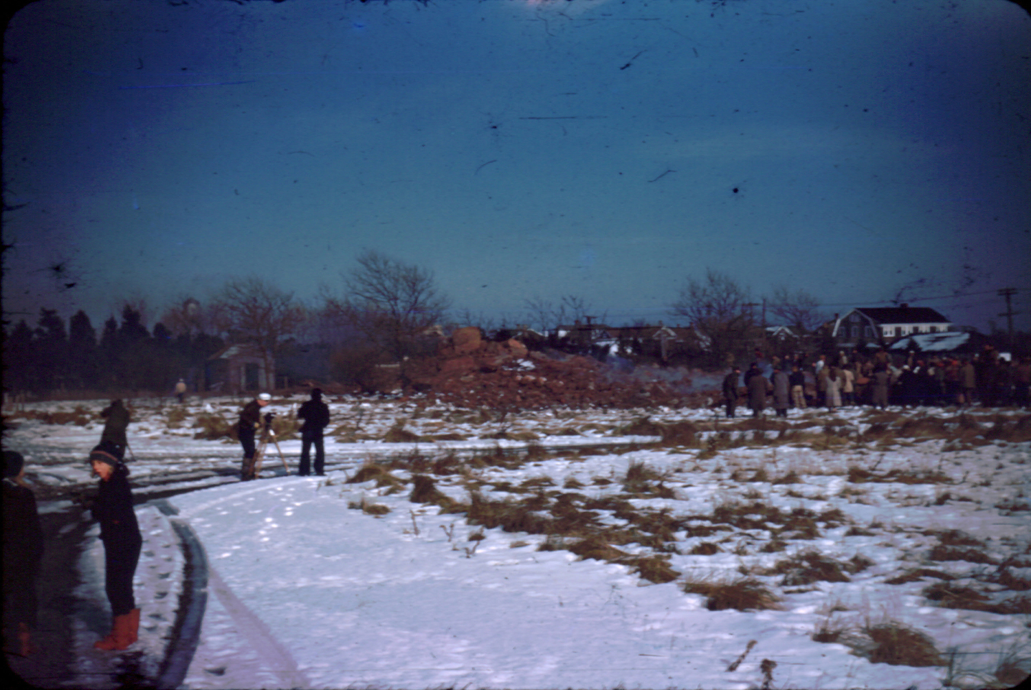 Spectators examine the rubble after the Shinnecock Lighthouse was brought down.